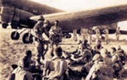 Colonel James M Gavin - Commanding Officer of the 505th PIR - gives his men last minute instructions before Operation Husky I (Photo Courtesy of Les Cruise)