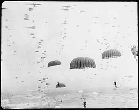 Paratroopers drop over the skies of Holland during D-Day landings June 6, 1944. Photo Source: National Archives